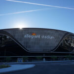 Allegiant Stadium in Las Vegas with the sun rising over the stadium