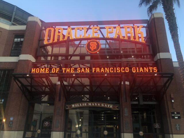 Sign at Oracle Park, home of the San Francisco Giants. Guide includes info on events, tickets, parking, hotels, seating, food and more.