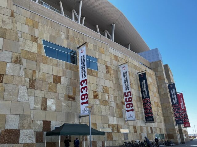 Limestone exterior façade at Target Field in Minneapolis, with Twins franchise banners adorning the wall