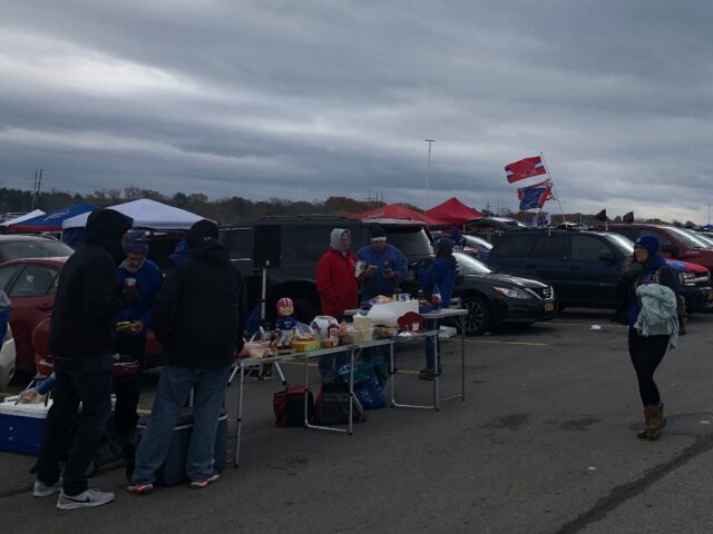 Tailgaters gather in the Highmark Stadium parking lot before a Buffalo Bills game