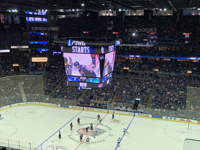 Players line up at center ice as a Columbus Blue Jackets game begins at Nationwide Arena