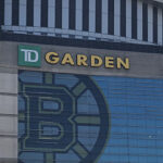 Exterior façade of TD Garden in Boston, with the Bruins and Celtics logos on display