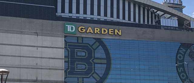 Exterior façade of TD Garden in Boston, with the Bruins and Celtics logos on display