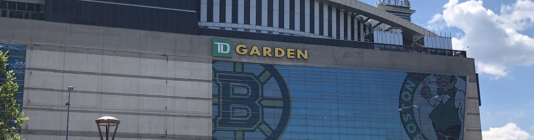 Exterior façade of TD Garden in Boston, with the Bruins and Celtics logos on display