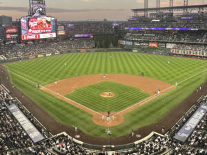 View of the field from behind home plate at Coors Field in Denver during a Colorado Rockies game