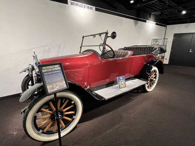 A replica of a 1920s automobile on display, representing the birth of the National Football League
