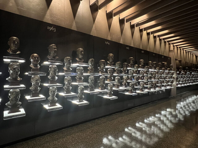 Busts for all the inductees of the Pro Football Hall of Fame line an exhibition room