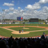 Players stand on the field during a spring training baseball game at BayCare Ballpark in Clearwater, Florida