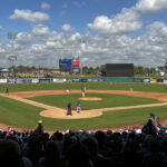 Players stand on the field during a spring training baseball game at BayCare Ballpark in Clearwater, Florida