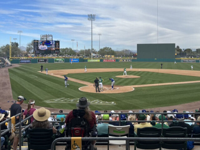 An Oakland A's spring training game in progress at Hohokam Stadium in Mesa, Arizona during the Cactus League