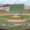 Players talk on the pitcher's mound during a spring training game at Sloan Park in Mesa, Arizona