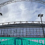 Panoramic view of the distinctive arch spanning above Wembley Stadium in London