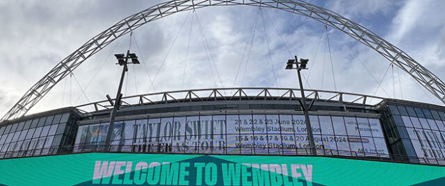 Panoramic view of the distinctive arch spanning above Wembley Stadium in London