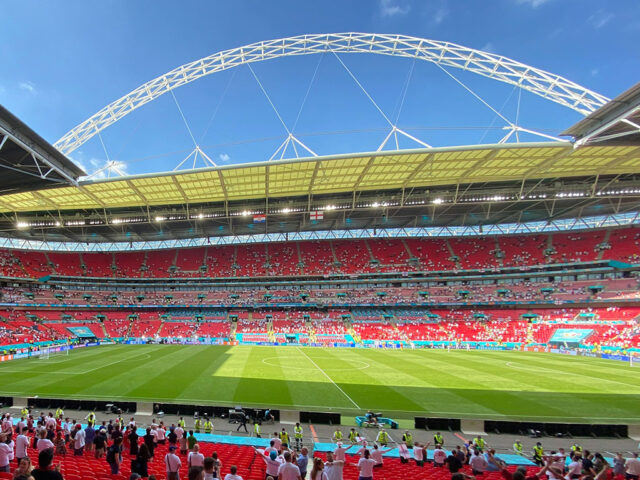 Fans enter the stands prior to a match at Wembley Stadium in London