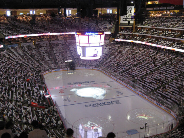 The lights are dimmed at Jobing.com Arena before a Phoenix Coyotes playoff game in 2012
