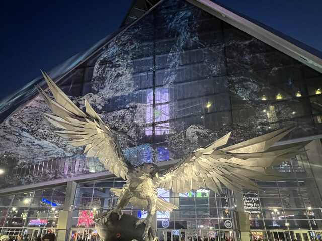 A large metallic falcon statue stands in front of Gate 2 at Mercedes-Benz Stadium in Atlanta
