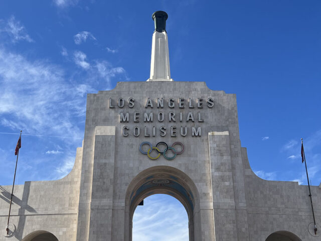 The Olympic torch stands atop the Los Angeles Memorial Coliseum