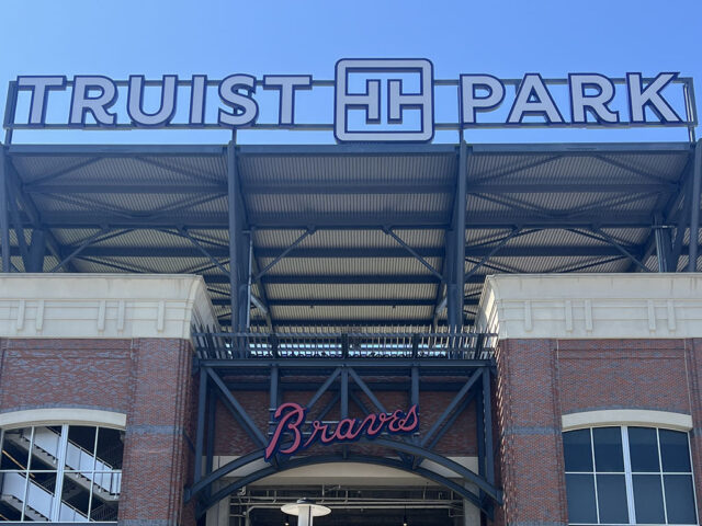 Signage on the exterior of Truist Park shows the stadium name and the Atlanta Braves logo