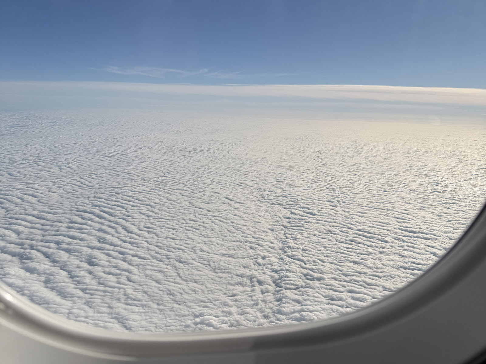 Clouds seen from the window of an airplane during the daytime