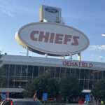 The back of one of the main scoreboards looms over the east entrance gate at GEHA Field at Arrowhead Stadium