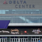 Displays featuring the logos of the Utah Jazz and Utah Hockey Club are seen outside the northeast gate of the Delta Center in Salt Lake City