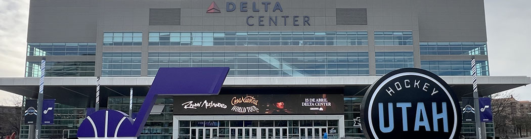 Displays featuring the logos of the Utah Jazz and Utah Hockey Club are seen outside the northeast gate of the Delta Center in Salt Lake City