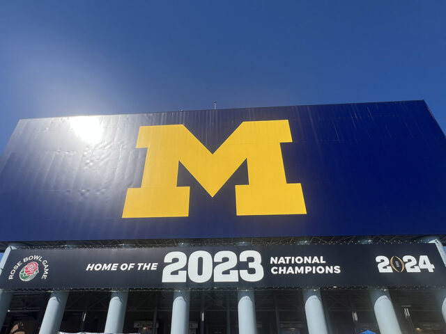 The University of Michigan's block M logo is displayed on the back of the scoreboard at Michigan Stadium
