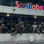 Statues of Maple Leafs greats stand outside the west entrance to Scotiabank Arena in Toronto
