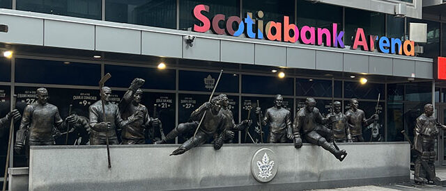 Statues of Maple Leafs greats stand outside the west entrance to Scotiabank Arena in Toronto