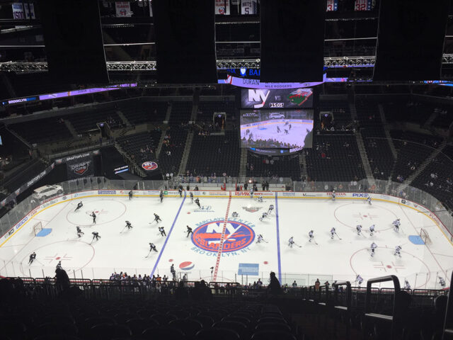 Players warm up on the ice before a New York Islanders game at Barclays Center in 2016