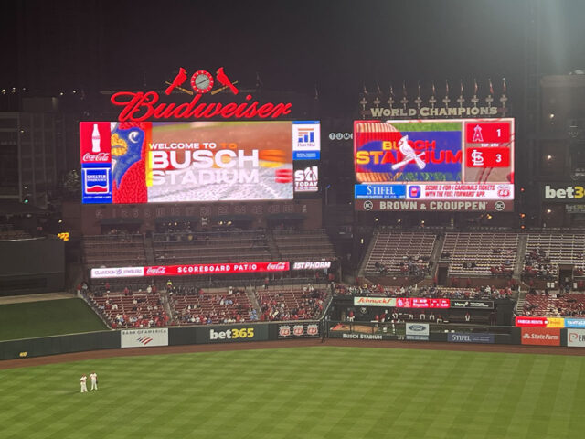 Two videoboards stand above the right-center field bleachers at Busch Stadium in St. Louis