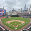 View of the field from behind home plate at Comerica Park, with the downtown Detroit skyline in the background