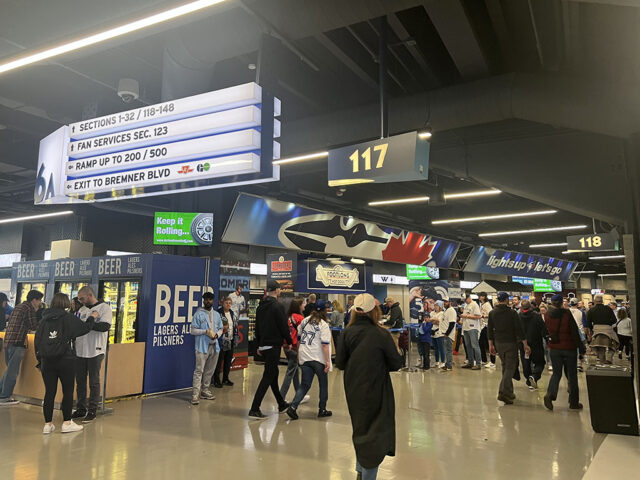 Fans walk through the 100-level concourse at Rogers Centre in Toronto