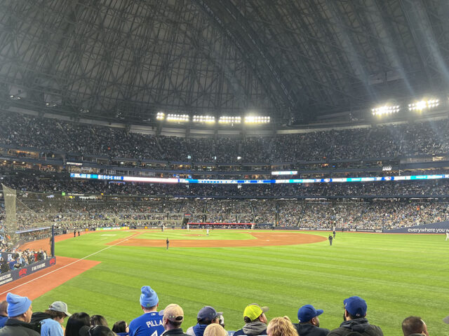 Fans look out onto the field from the right-field standing terrace at Rogers Centre in Toronto