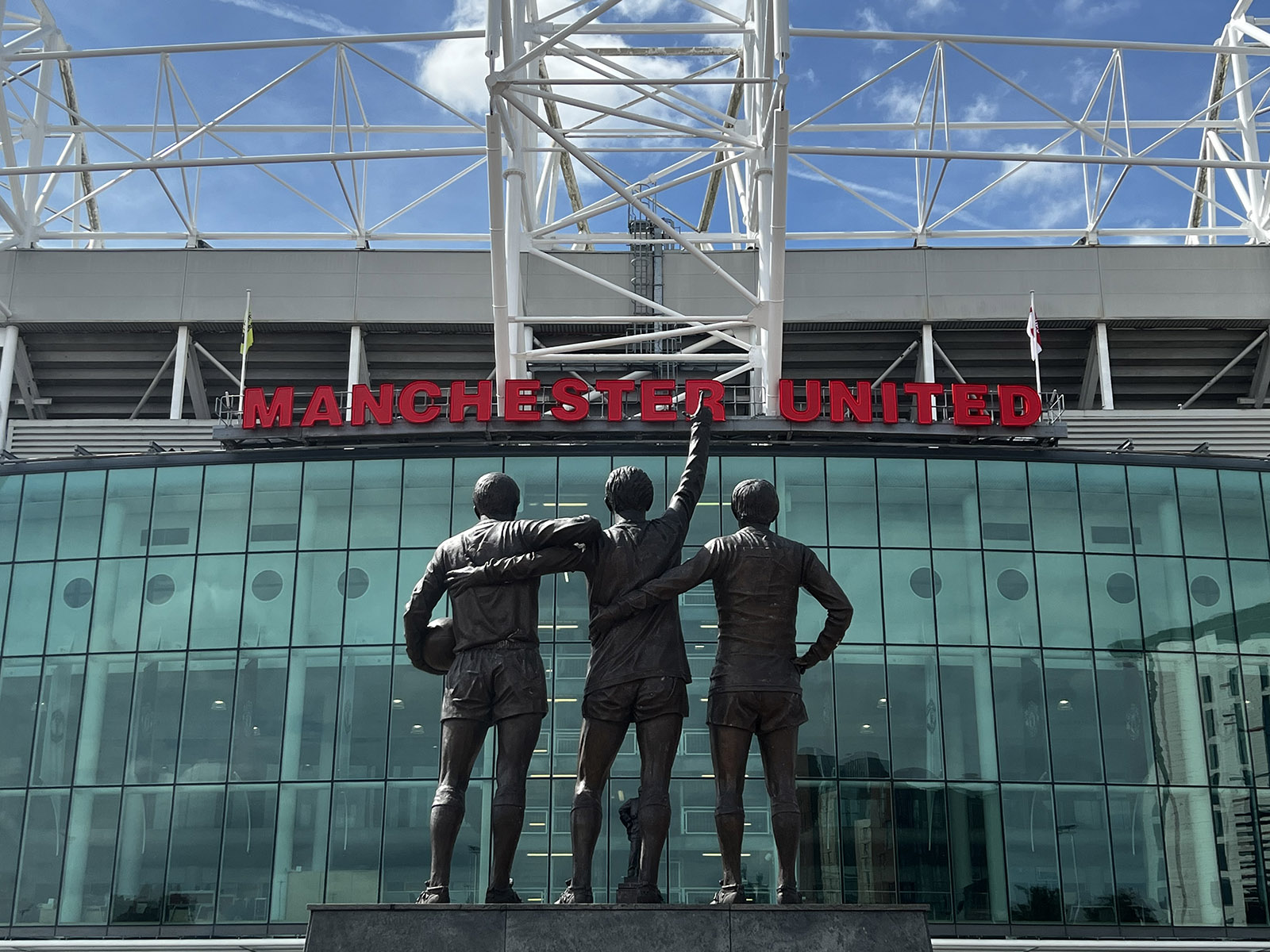 The Trinity statue stands in front of Old Trafford stadium in Manchester, England