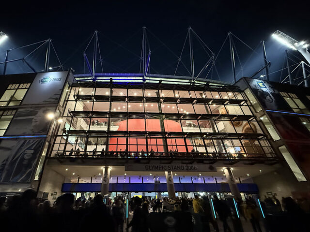 Nighttime exterior view of the Olympic stand at the Melbourne Cricket Ground in Australia