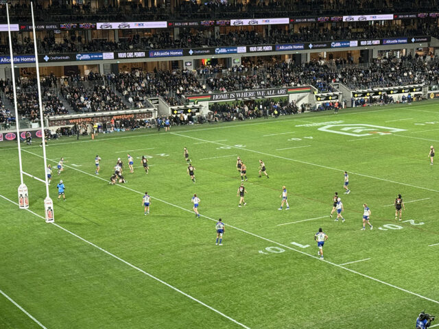Players seen on the field during an NRL rugby match at CommBank Stadium in Parramatta, Australia