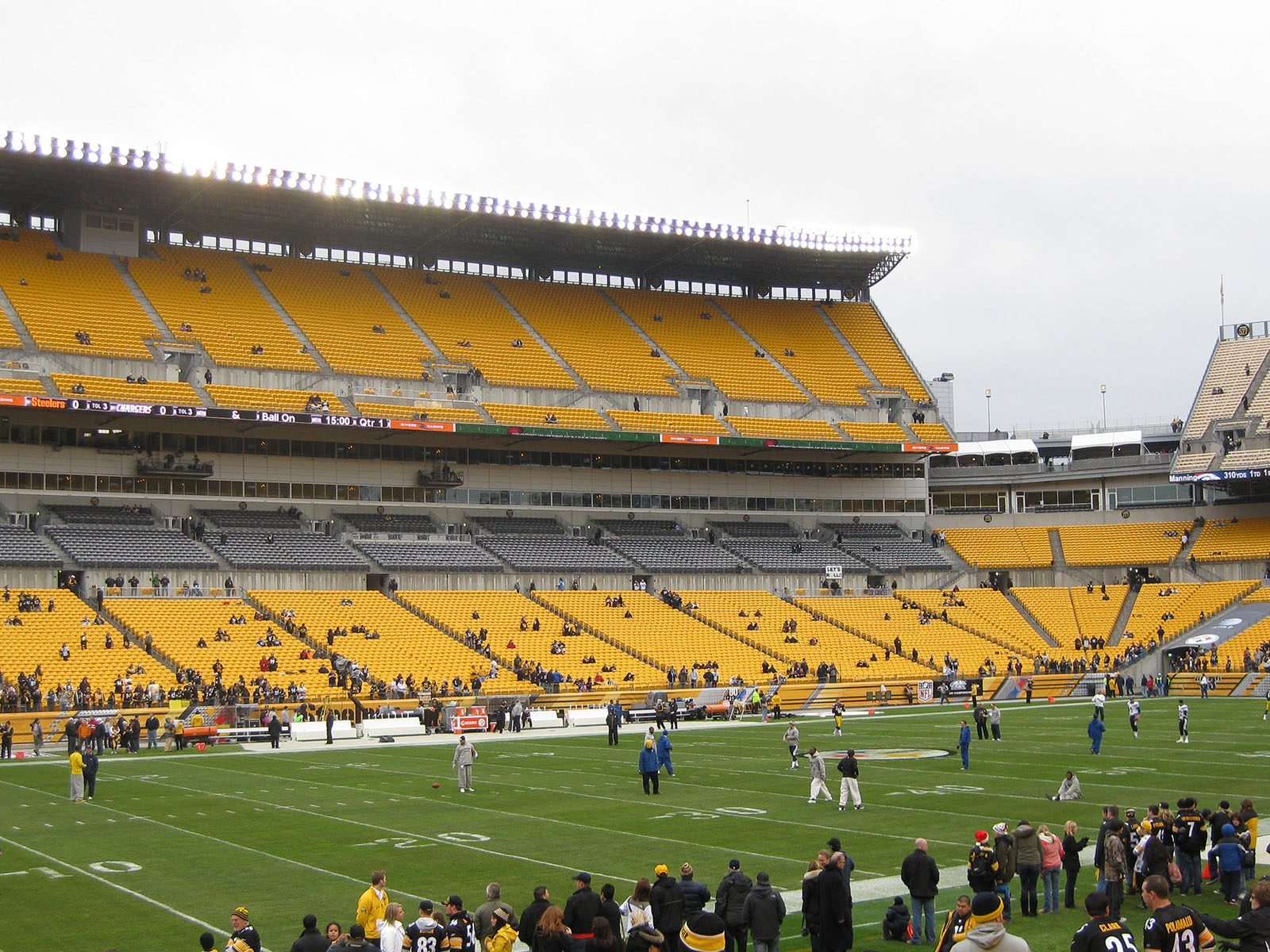 Players warm up on the field prior to a Steelers football game at Acrisure Stadium in Pittsburgh, Pennsylvania