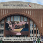A long plaza leads to the entrance of American Airlines Center in Dallas, Texas