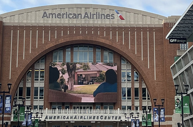 A long plaza leads to the entrance of American Airlines Center in Dallas, Texas