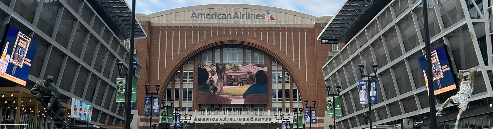 A long plaza leads to the entrance of American Airlines Center in Dallas, Texas