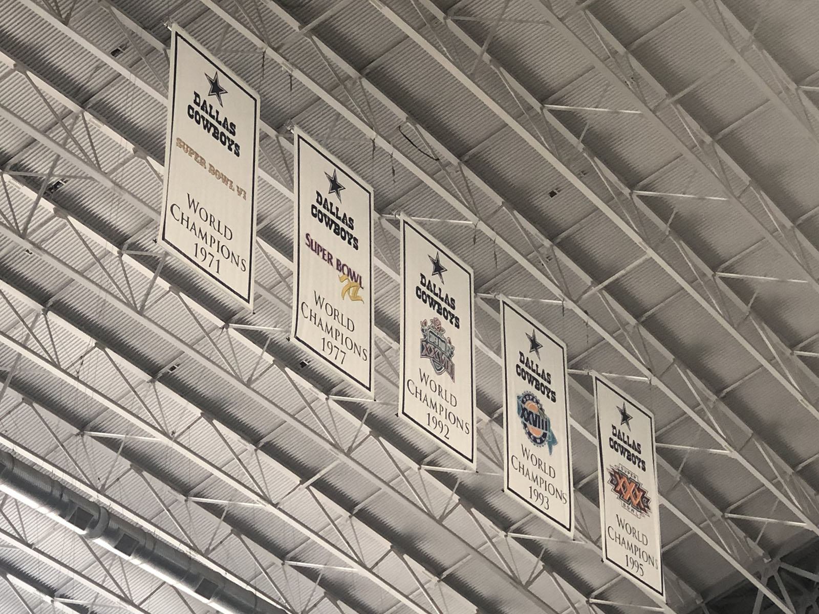 AT&T Stadium Dallas Cowboys championship banners hang from the rafters at AT&T Stadium in Arlington, Texas