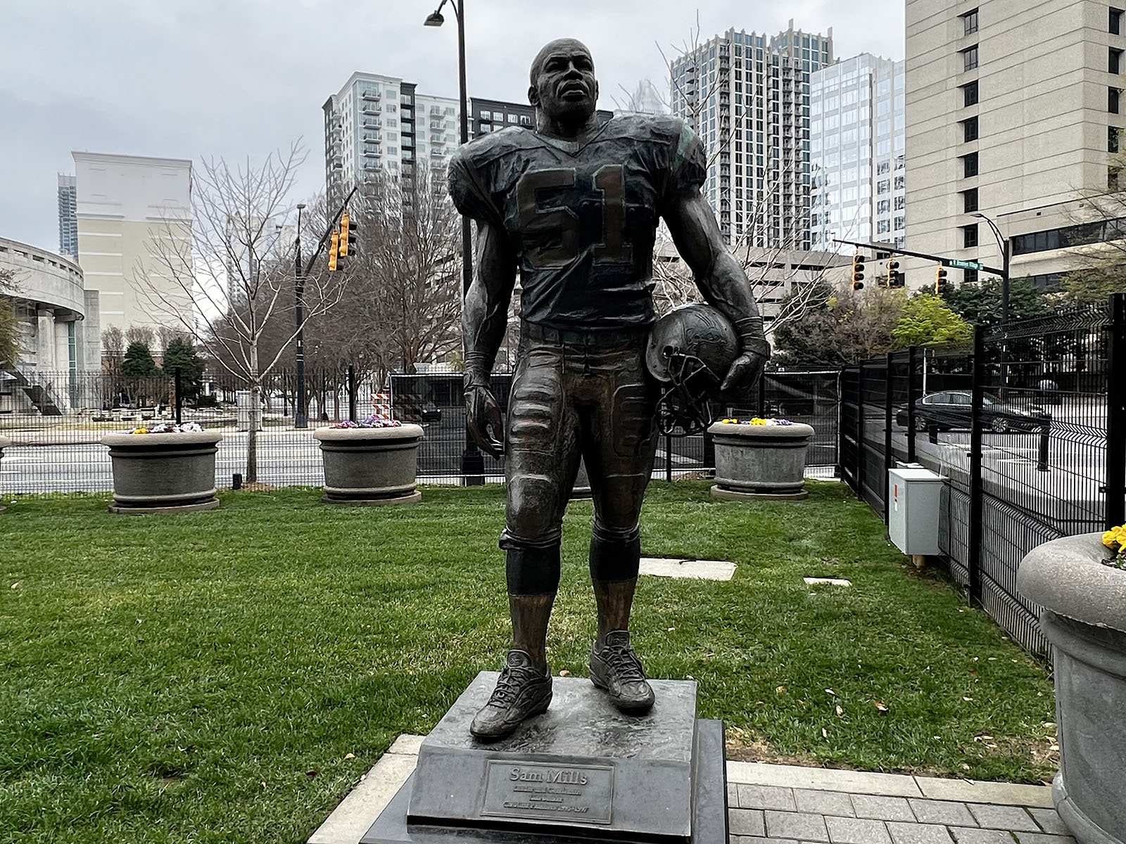 A statue of Carolina Panthers great Sam Mills stands in front of Bank of America Stadium in Charlotte, North Carolina