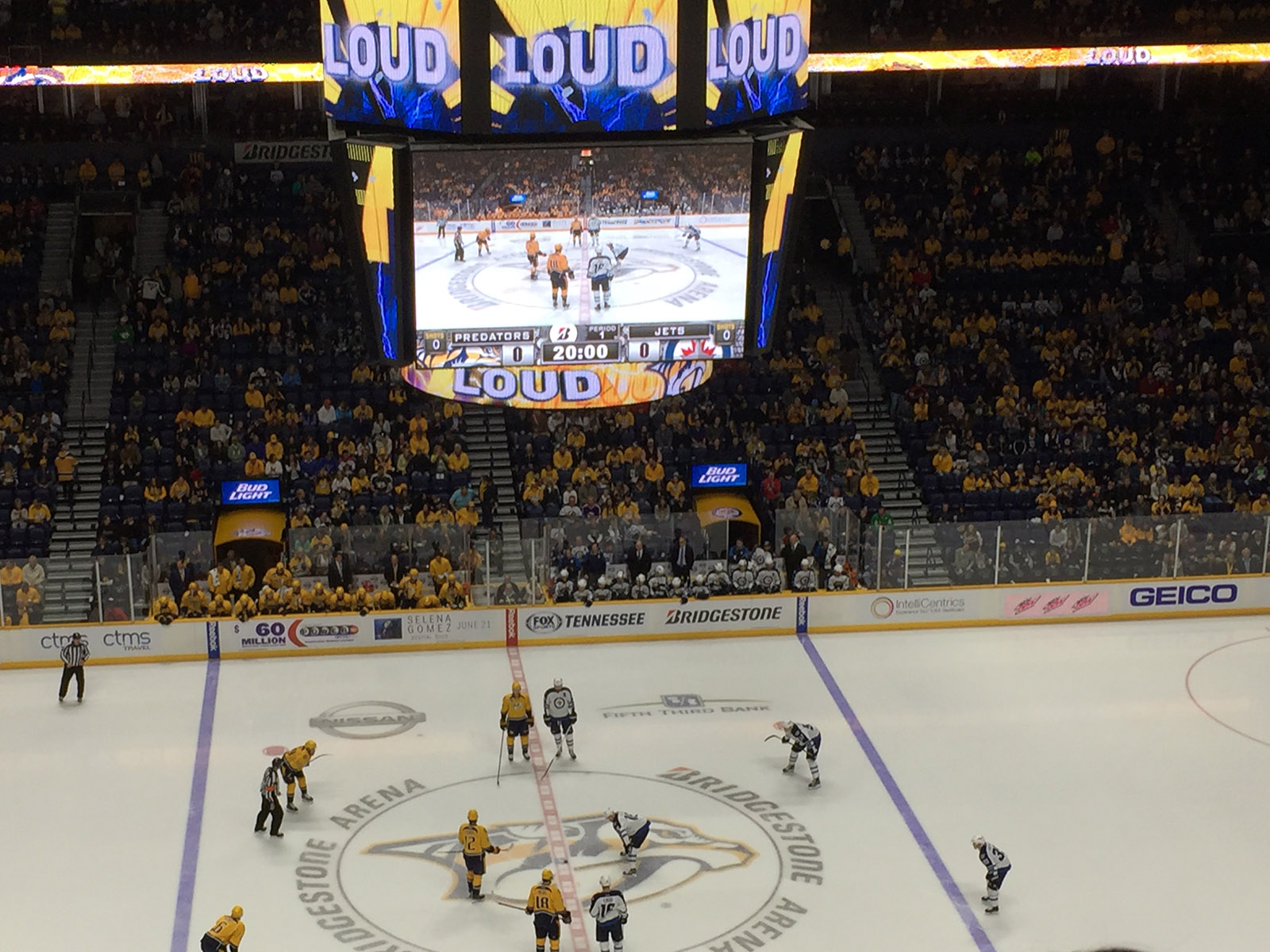 Players line up at center ice for the start of a Predators hockey game at Bridgestone Arena in Nashville, Tennessee