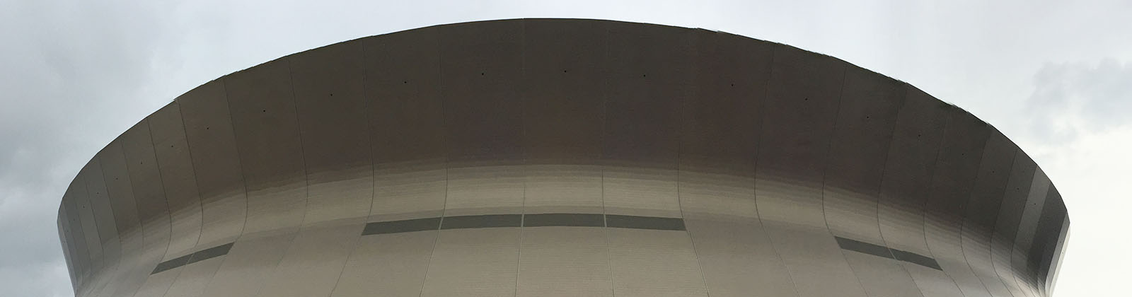 View of the distinctive exterior shape of the Caesars Superdome in New Orleans, Louisiana