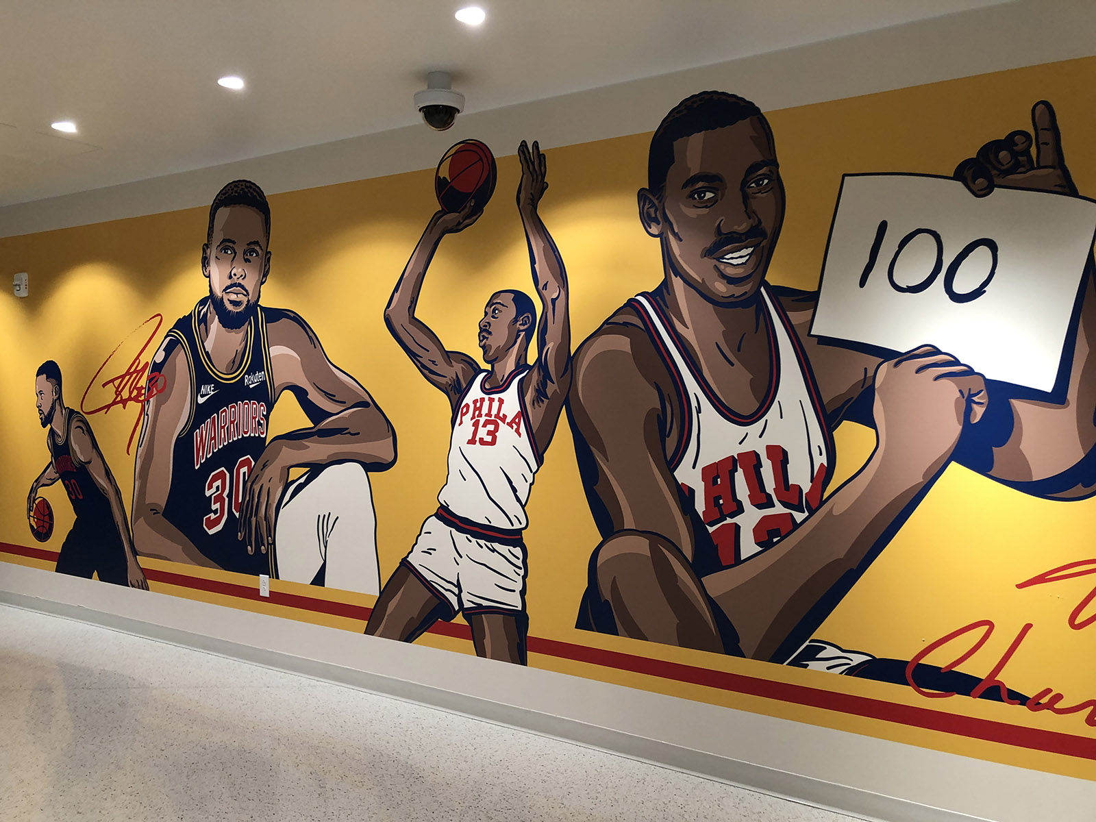 Golden State Warriors players throughout history are depicted on a mural inside Chase Center in San Francisco, California