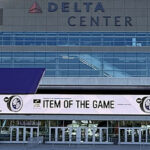 Utah Jazz and Utah Mammoth logos are displayed in front of the northeast entrance to the Delta Center in Salt Lake City