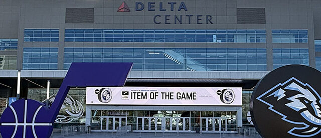 Utah Jazz and Utah Mammoth logos are displayed in front of the northeast entrance to the Delta Center in Salt Lake City