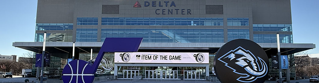 Utah Jazz and Utah Mammoth logos are displayed in front of the northeast entrance to the Delta Center in Salt Lake City