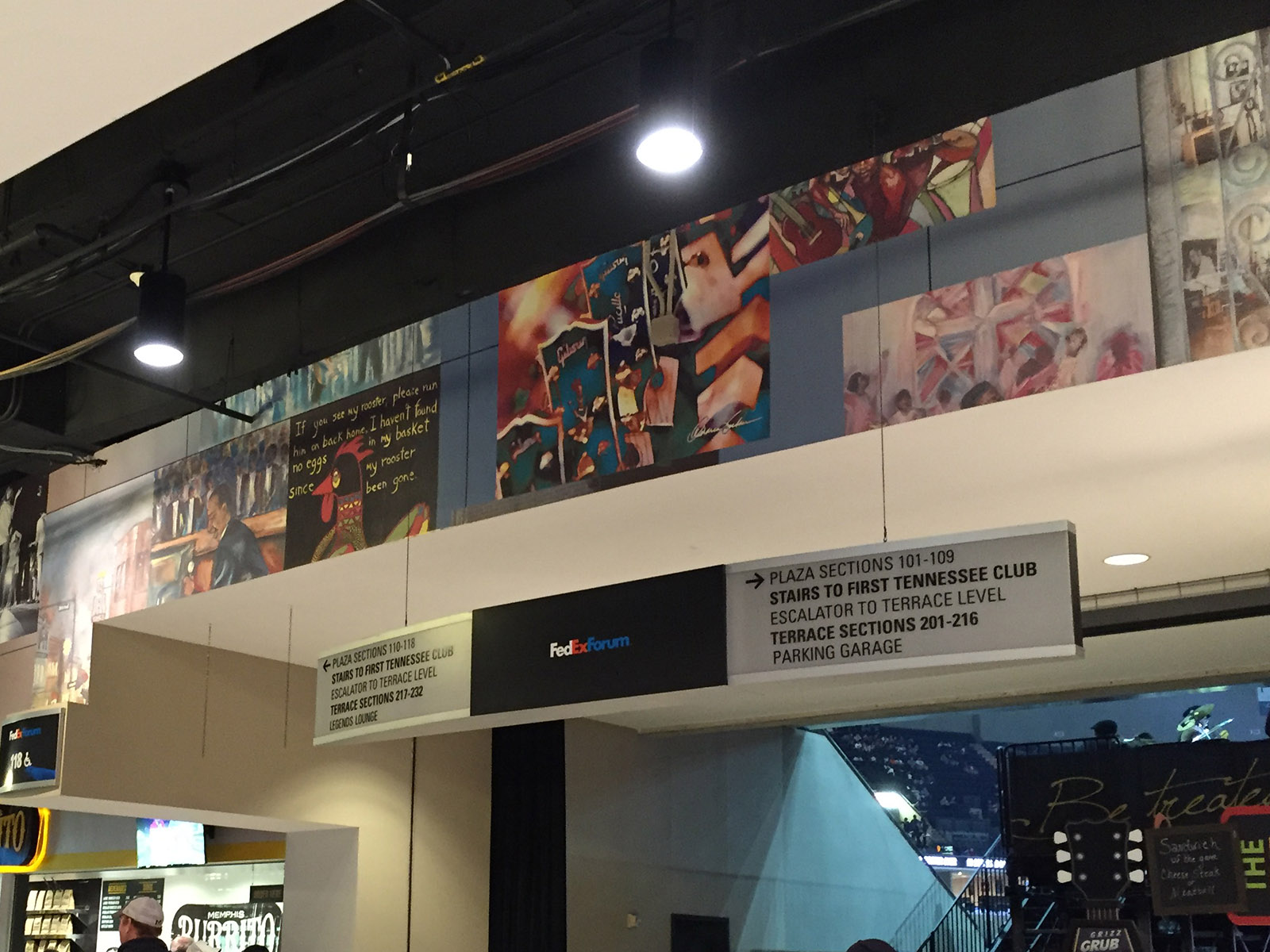 A mural is displayed above the concourse at FedExForum in Memphis, Tennessee